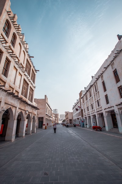 Painted cream-colored buildings during the day
